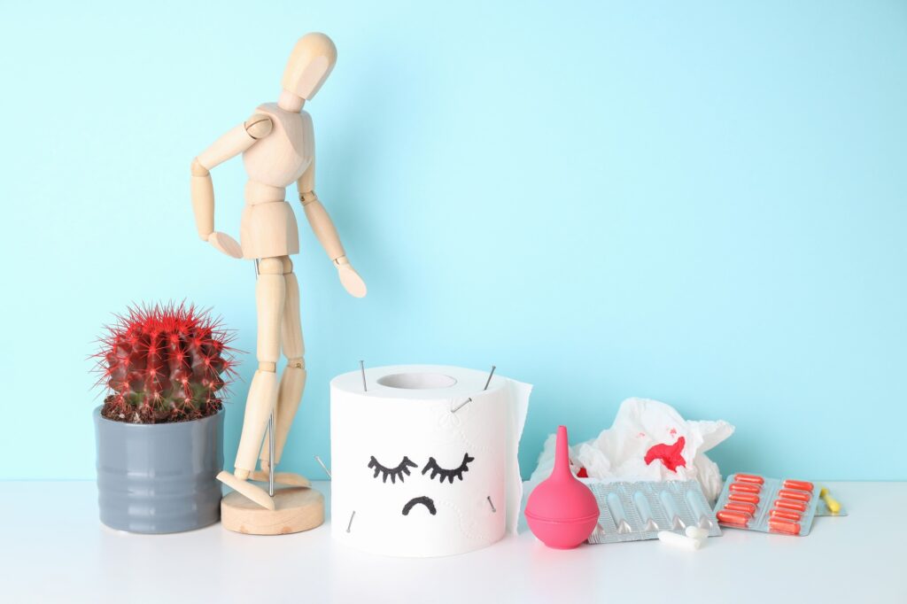 Concept of healthcare with hemorrhoids accessories on white table